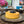 Yellow cake with blueberries on a decorative plate in a home setting